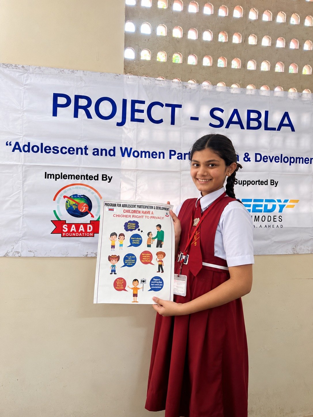 A SABALA participant presenting a child rights awareness poster